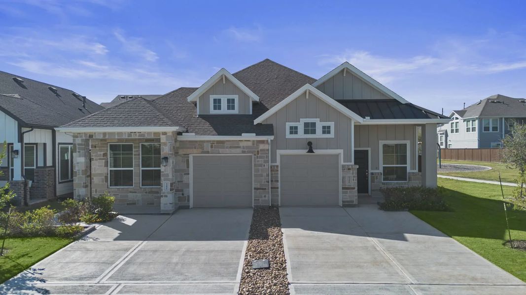 Representative exterior photo of a completed home built from the Carriagehouse by Chesmar Homes in Meridiana Townhomes, Iowa Colony, TX (Image 30).