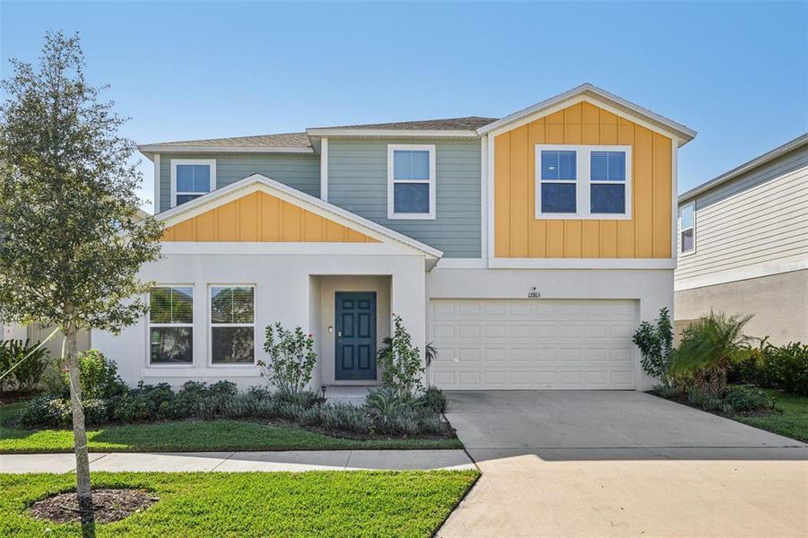 Front exterior of a new home in Hawkstone, Lithia, FL, highlighting curb appeal (Image 1). Front exterior of a new home in Hawkstone, Lithia, FL, highlighting curb appeal (Image 1).