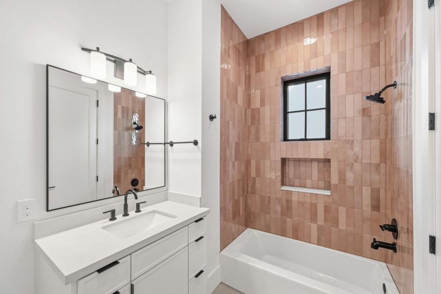 The vibrant tile, privacy window, and large walk-in closet are all winners!