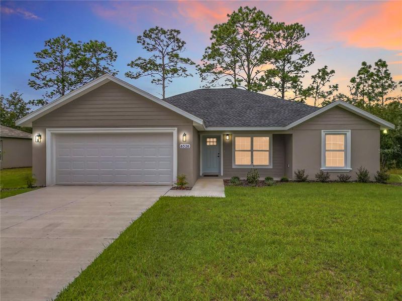 Front exterior of a new home in , Citrus Springs, FL, highlighting curb appeal (Image 2). Front exterior of a new home in , Citrus Springs, FL, highlighting curb appeal (Image 2).
