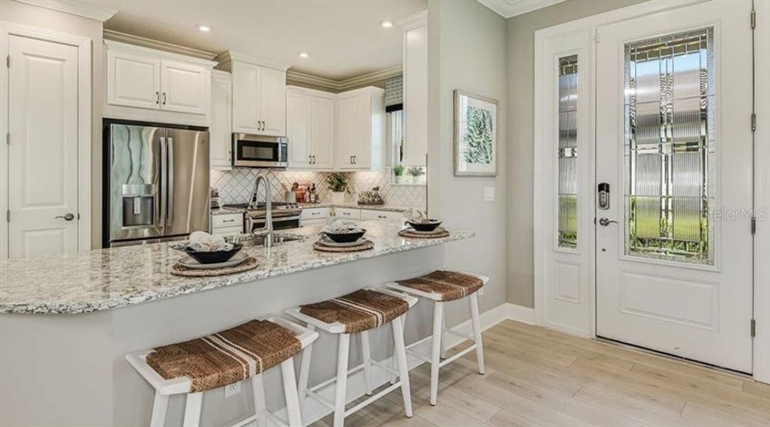Furnished interior view inside a new home in Esplanade at Azario Lakewood Ranch, Bradenton (Image 10).