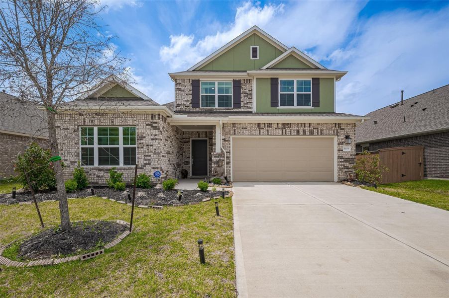 Front exterior of a new home in Marvida, Cypress, TX, highlighting curb appeal (Image 20).