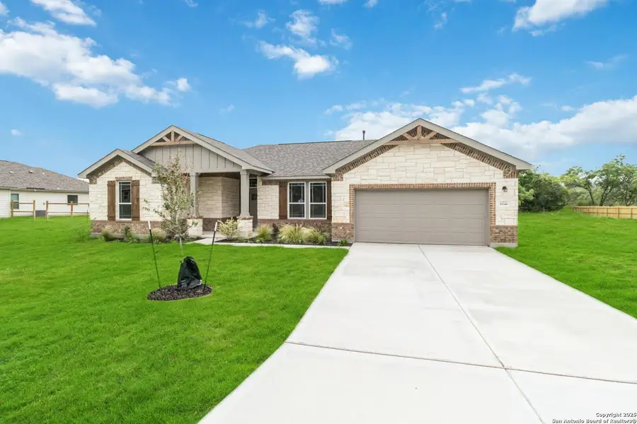 Front exterior of a new home in Lonesome Dove, San Antonio, TX, highlighting curb appeal (Image 1). Front exterior of a new home in Lonesome Dove, San Antonio, TX, highlighting curb appeal (Image 1).