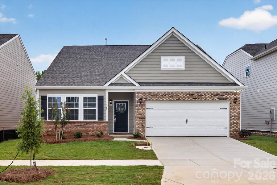 Front exterior of a new home in Secrest Commons, Monroe, NC, highlighting curb appeal (Image 1). Front exterior of a new home in Secrest Commons, Monroe, NC, highlighting curb appeal (Image 1).