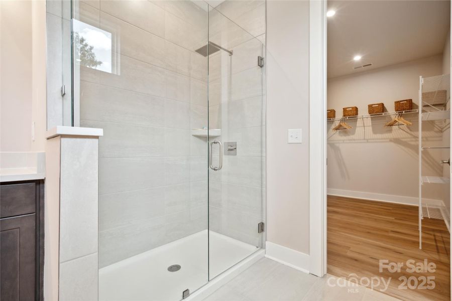 Modern Tiled Walk-In Primary Shower. *Model Photos | Actual Finishes, Structural Selections, and Orientation May Vary.