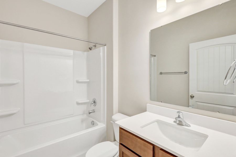 Representative furnished interior of a home built from the The Dublin by Smith Family Homes in Settlers Hammock, Kingsland (Image 28).