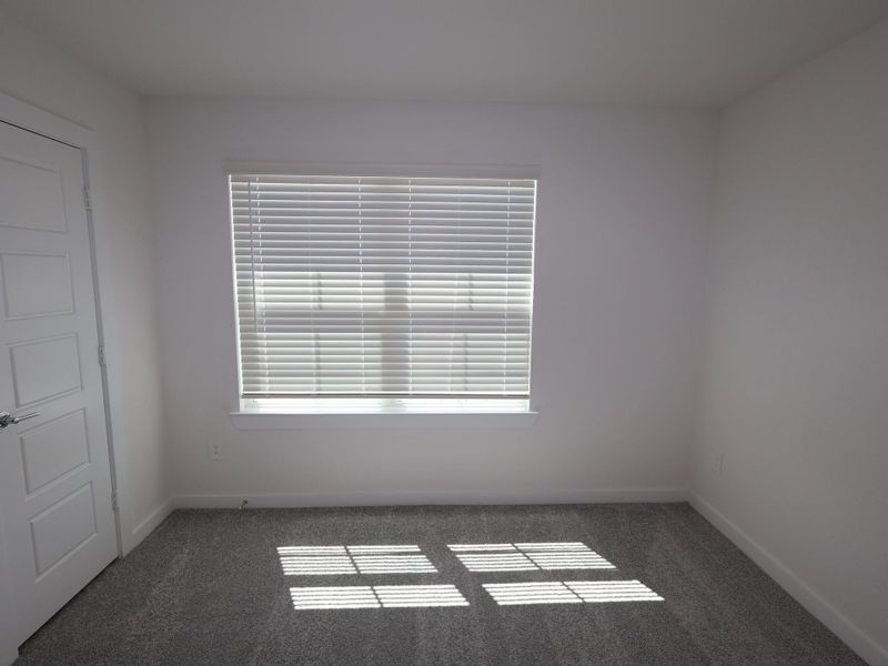 Spacious, unfurnished interior of a new home in Pinewood at Grand Texas, New Caney (Image 26).