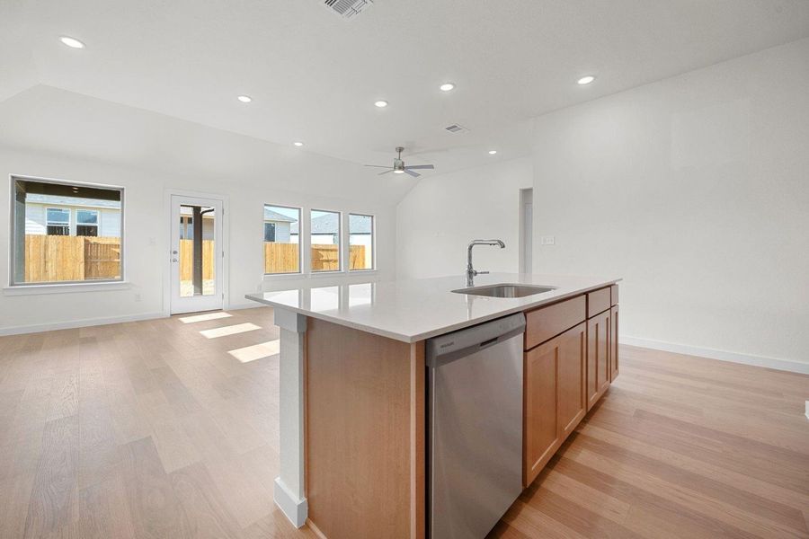 Kitchen in the Sabine home plan by Trophy Signature Homes – REPRESENTATIVE PHOTO