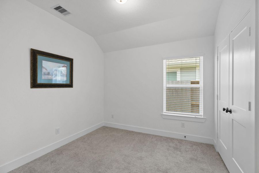 One of two secondary bedrooms.