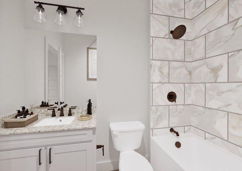 A modern bathroom features a sleek vanity with a granite countertop and tiled shower. A modern bathroom features a sleek vanity with a granite countertop and tiled shower.