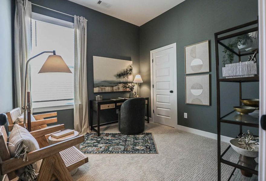 Room featuring a window with blinds and drapes, a five-panel door, and textured carpet flooring