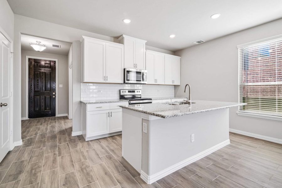 Representative furnished interior of a home built from the The Tulip by Lillian Custom Homes in The Preserve, Sherman (Image 6).