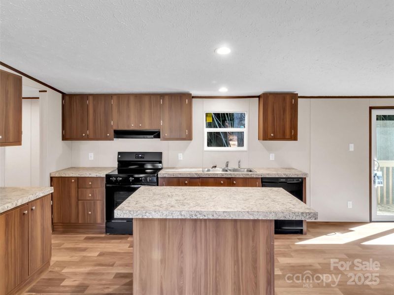 Furnished interior view inside a new home in , Waynesville (Image 10).
