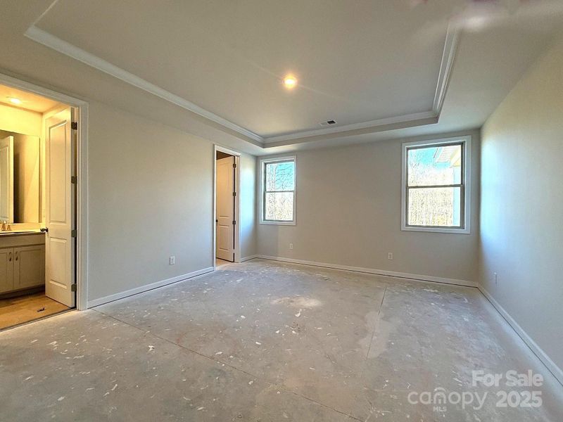 PRIMARY BEDROOM (MAIN LEVEL) - CONSTRUCTION PHOTO 12/15/25 PRIMARY BEDROOM (MAIN LEVEL) - CONSTRUCTION PHOTO 12/15/25