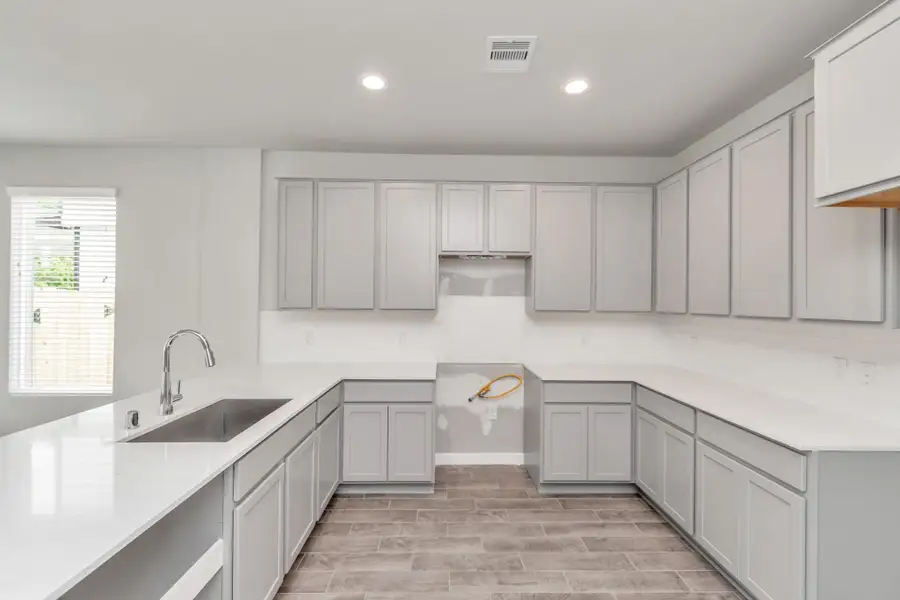 This generously spacious kitchen is a dream realized! Sample photo of completed home with similar floor plan. Actual colors and selections may vary. This generously spacious kitchen is a dream realized! Sample photo of completed home with similar floor plan. Actual colors and selections may vary.