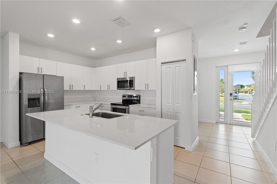 Furnished interior view inside a new home in Harmony Parc, Homestead (Image 7).
