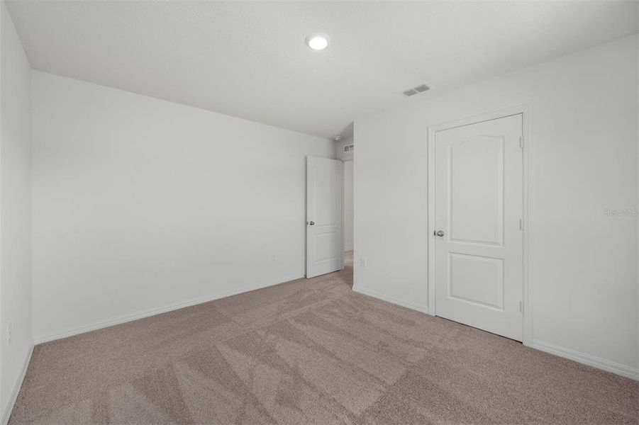 Spacious, unfurnished interior of a new home in Peach Crossings, Winter Haven (Image 21).