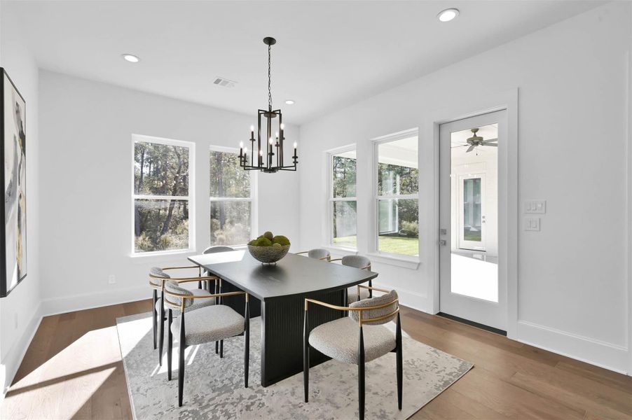 Modern hanging fixture is the perfect jewelry in this space. Easy access to backyard patio from dining/kitchen. Modern hanging fixture is the perfect jewelry in this space. Easy access to backyard patio from dining/kitchen.