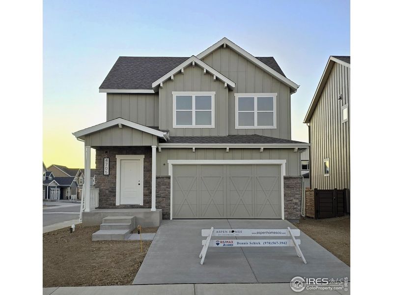 Front exterior of a new home in Wilson Commons, Loveland, CO, highlighting curb appeal (Image 16). Front exterior of a new home in Wilson Commons, Loveland, CO, highlighting curb appeal (Image 16).