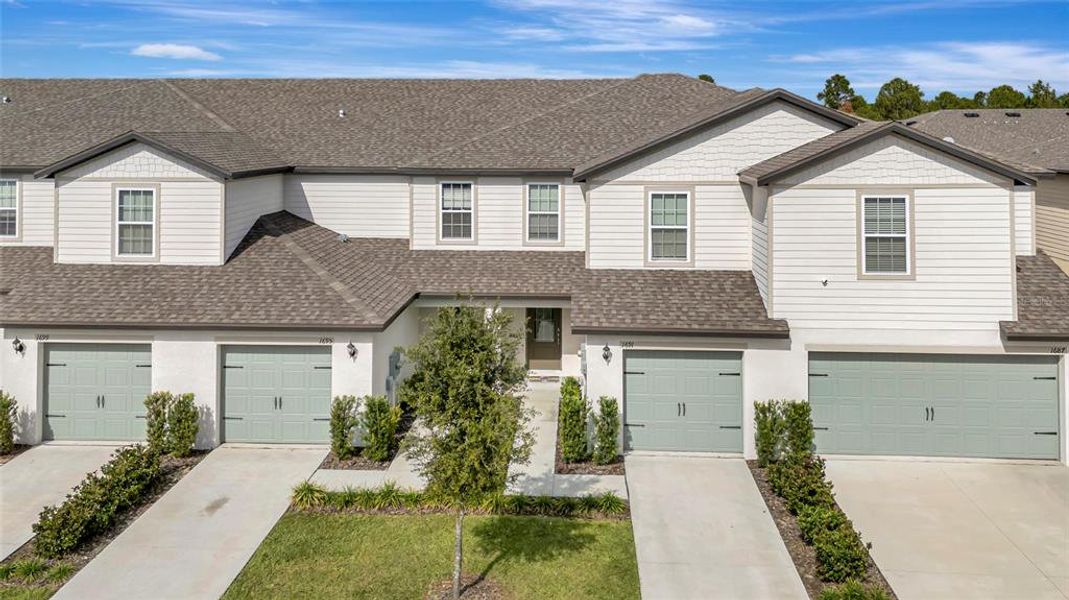 Front exterior of a new home in Hamlets of Tavares, Tavares, FL, highlighting curb appeal (Image 1). Front exterior of a new home in Hamlets of Tavares, Tavares, FL, highlighting curb appeal (Image 1).