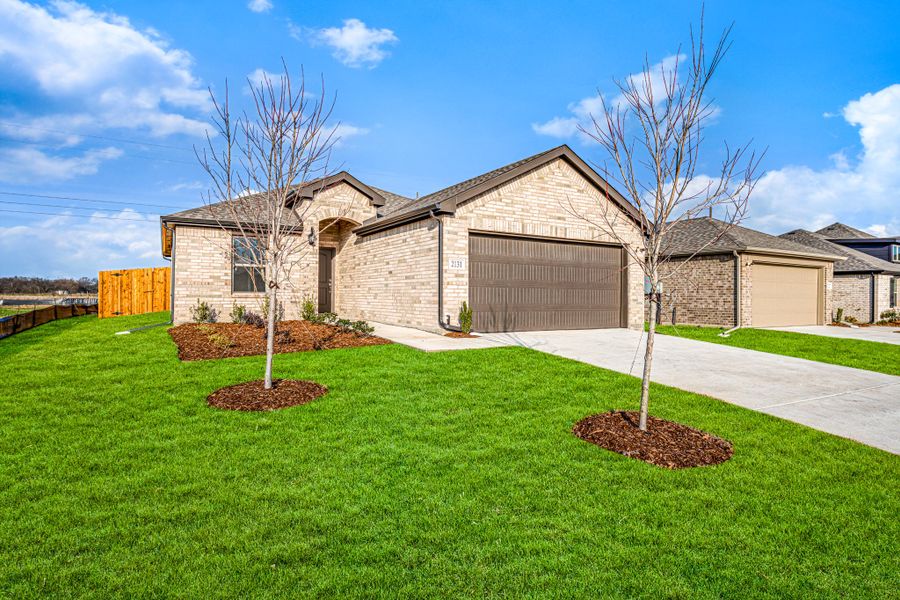 Front exterior of a new home in Stonecreek, Sulphur Springs, TX, highlighting curb appeal (Image 24).