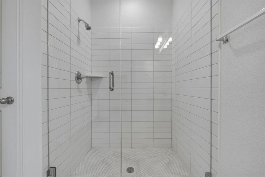 Full bathroom with a shower stall