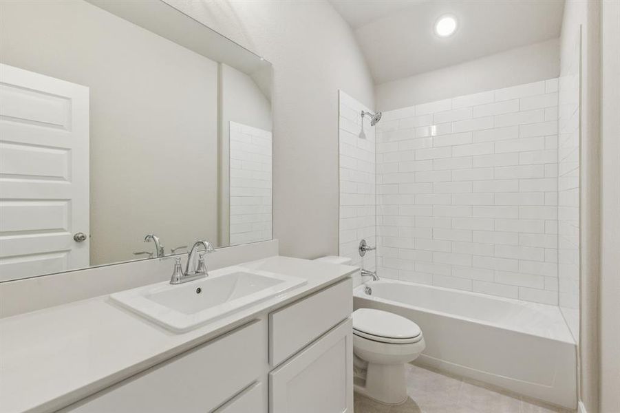 Bathroom in the Heisman home plan by Trophy Signature Homes – REPRESENTATIVE PHOTO