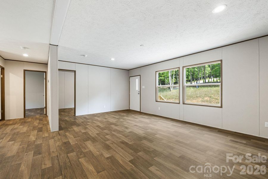 In living room facing two guest bedrooms which share a full bathroom