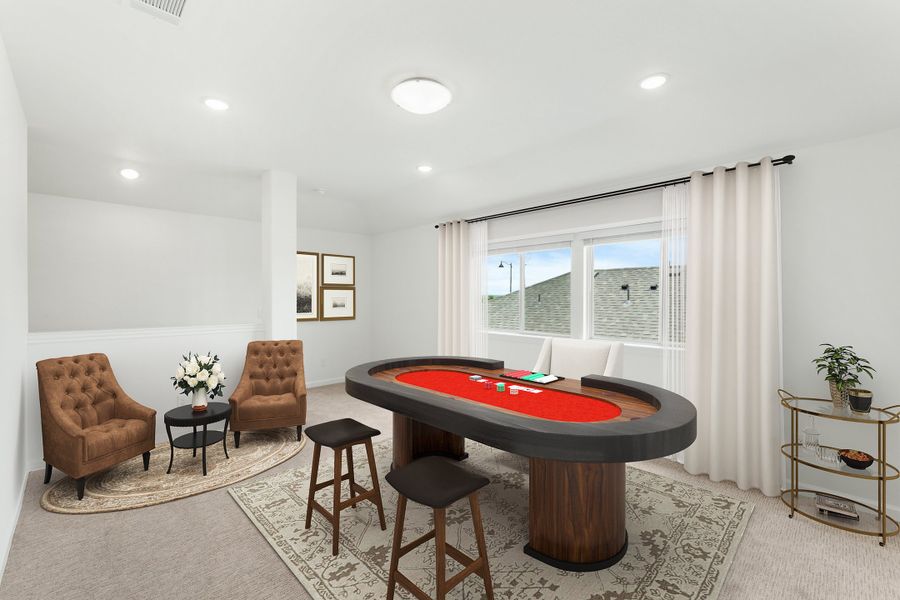 Game room with oval poker table, bar stools, and two brown armchairs on carpet
