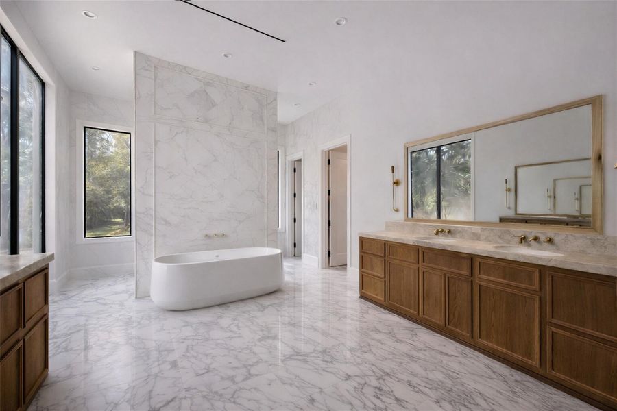 Rendering: Large primary bathroom is finished with white oak cabinetry and diamond patterned marble.