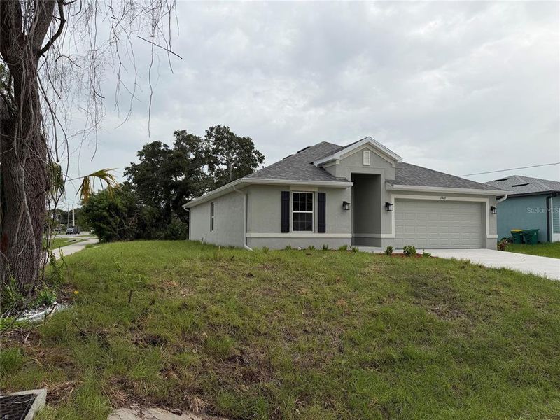 Front exterior of a new home in , Port Charlotte, FL, highlighting curb appeal (Image 8). Front exterior of a new home in , Port Charlotte, FL, highlighting curb appeal (Image 8).