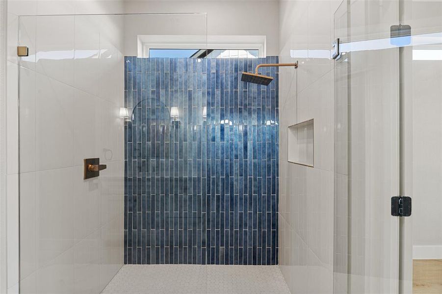 Bathroom with a shower with door and hardwood / wood-style flooring