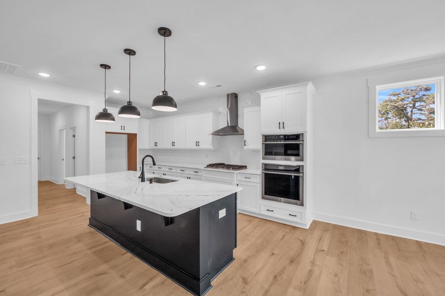 Representative furnished interior of a home built from the The Bradley by RobuckHomes in Windwater, Hampstead (Image 45).