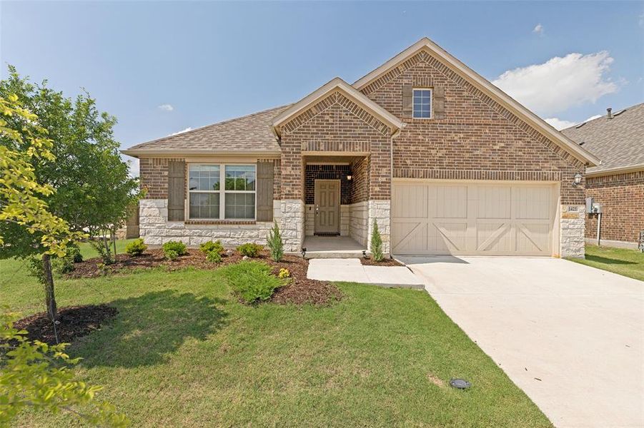 Front exterior of a new home in Light Farms - Sweetwater, Celina, TX, highlighting curb appeal (Image 1). Front exterior of a new home in Light Farms - Sweetwater, Celina, TX, highlighting curb appeal (Image 1).