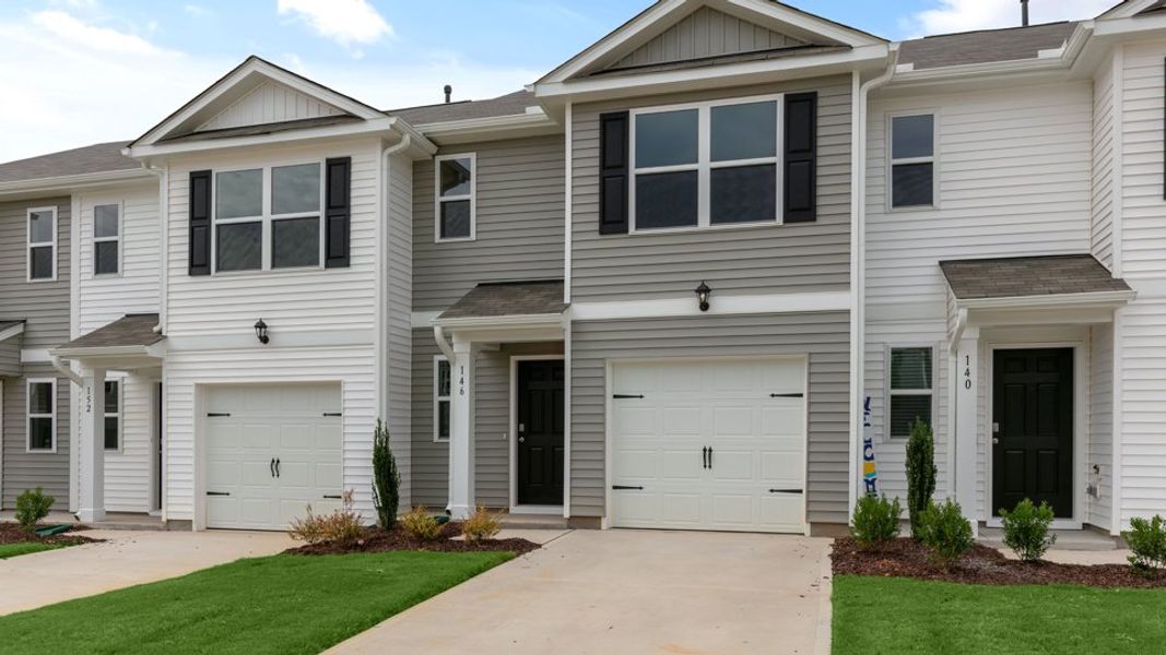 Front exterior of a new home in The Townes at Hunter Hill, Rocky Mount, NC, highlighting curb appeal (Image 23).