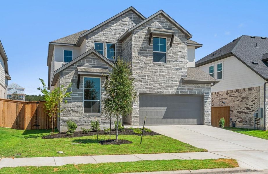 Front exterior of a new home in Arbor Collection at Heritage, Dripping Springs, TX, highlighting curb appeal (Image 21).