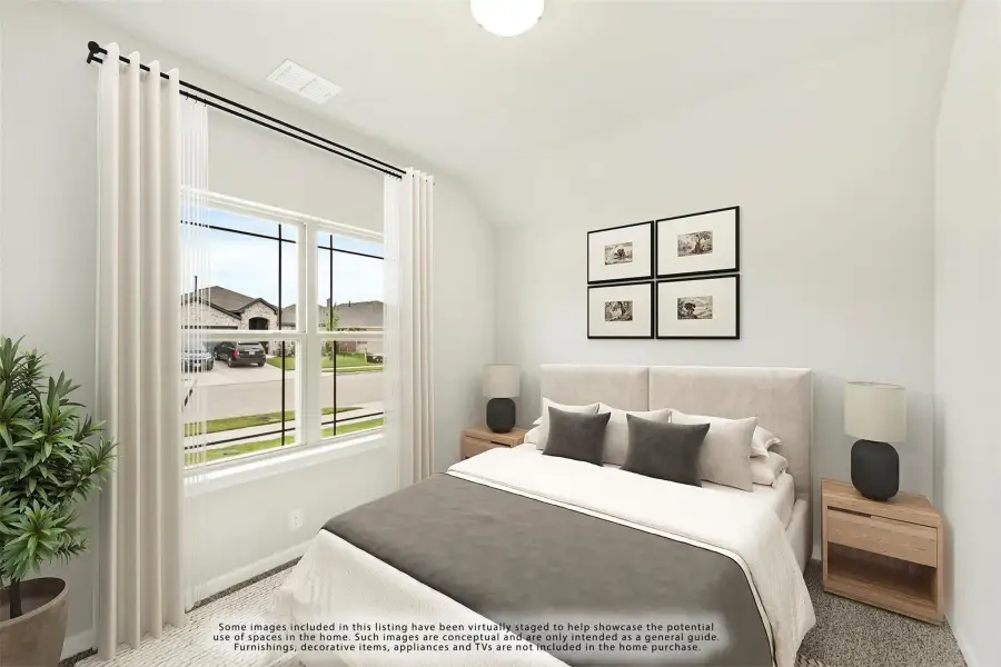 Bedroom with vaulted ceiling, large window, upholstered headboard, and two nightstands with lamps