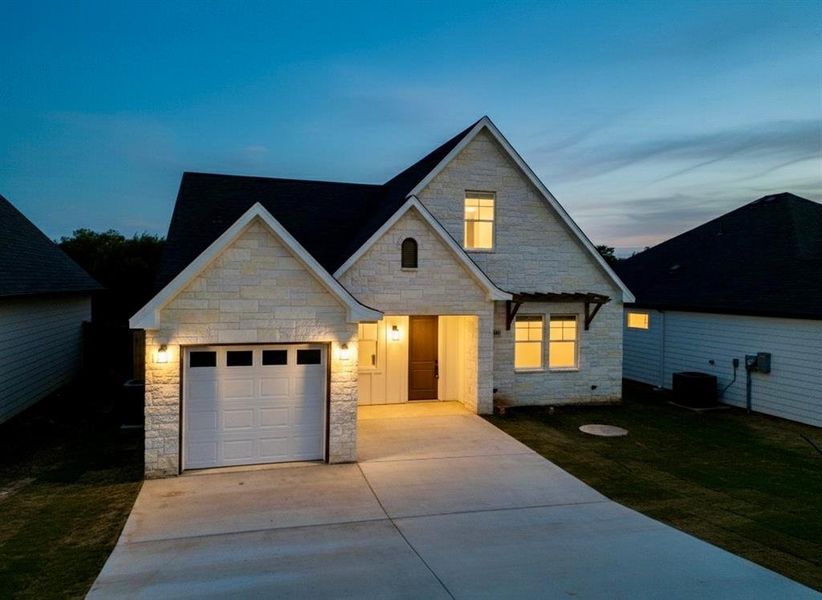 Front exterior of a new home in , Granbury, TX, highlighting curb appeal (Image 25). Front exterior of a new home in , Granbury, TX, highlighting curb appeal (Image 25).