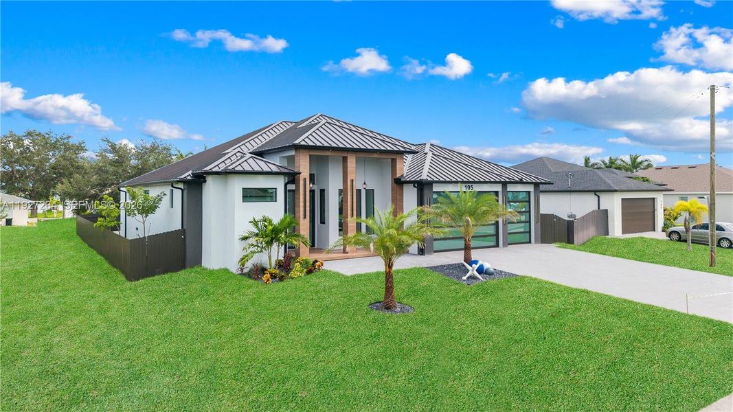 Front exterior of a new home in , Cape Coral, FL, highlighting curb appeal (Image 31). Front exterior of a new home in , Cape Coral, FL, highlighting curb appeal (Image 31).