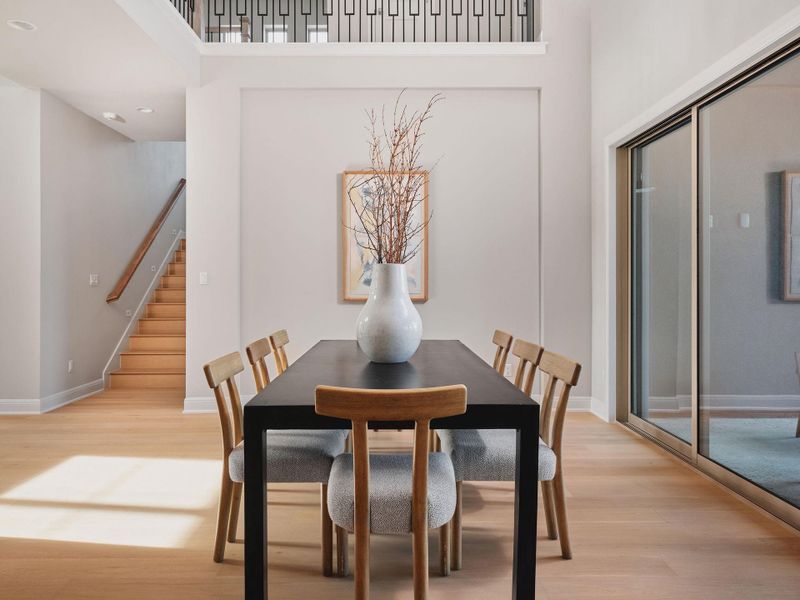 Warm wood flooring is found throughout the main living spaces.