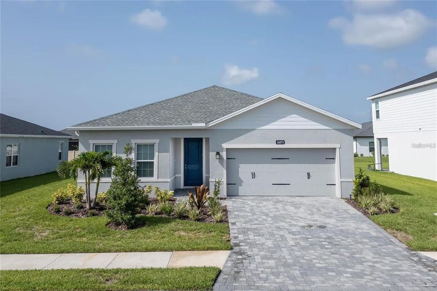 Front exterior of a new home in , Port Charlotte, FL, highlighting curb appeal (Image 21). Front exterior of a new home in , Port Charlotte, FL, highlighting curb appeal (Image 21).