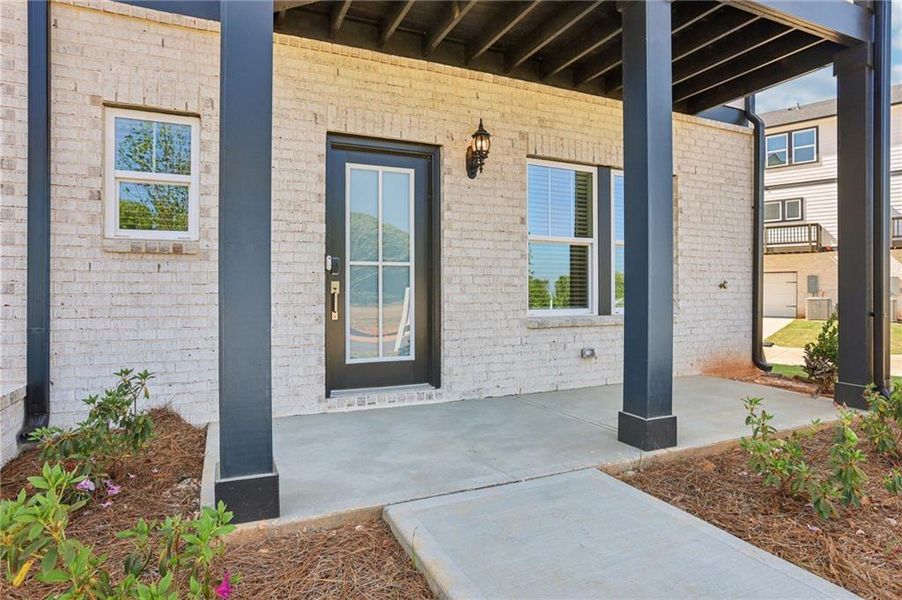 Exterior details and patio area of a home in Hemingway - Highland Series, Cumming (Image 28).