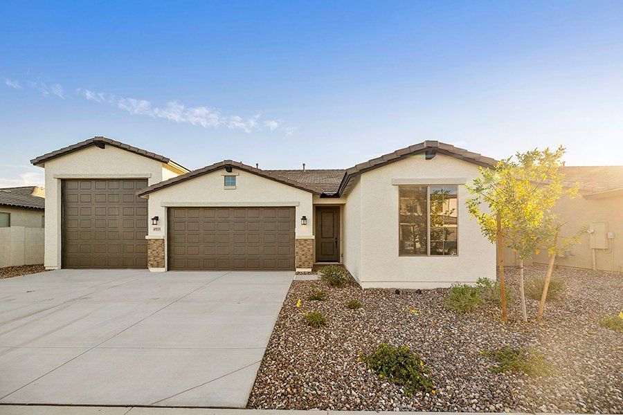 Front exterior of a new home in Laveen Vistas II, Phoenix, AZ, highlighting curb appeal (Image 1). Front exterior of a new home in Laveen Vistas II, Phoenix, AZ, highlighting curb appeal (Image 1).