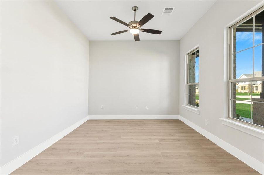 Spare room with baseboards and light colored carpet Spare room with baseboards and light colored carpet