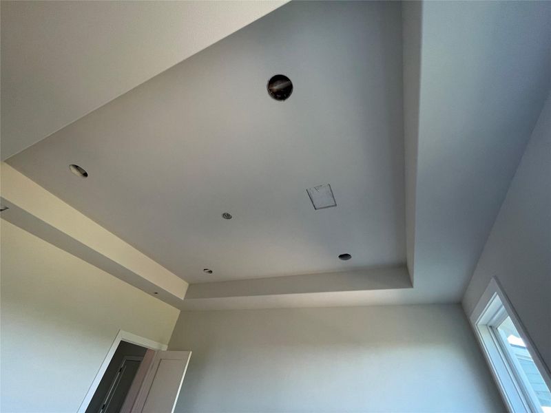 Primary bedroom ceiling with recessed lighting and tray design. Primary bedroom ceiling with recessed lighting and tray design.