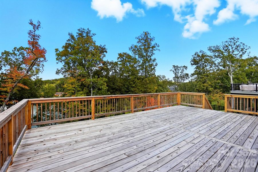 Take in the glorious lake views from your spacious deck, grill on the covered patio, enjoy fun boating adventures from your floating dock.