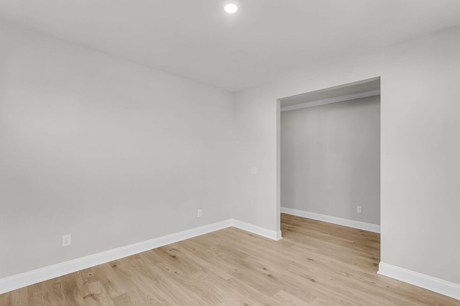 Spacious, unfurnished interior of a new home in Tidewater at Lakes of Cane Bay, Summerville (Image 54).