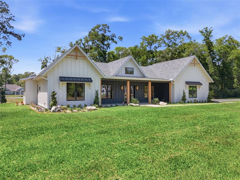Front exterior of a new home in , Newberry, FL, highlighting curb appeal (Image 26).