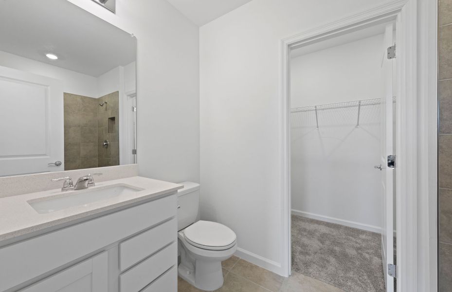 Owner's suite bathroom with closet