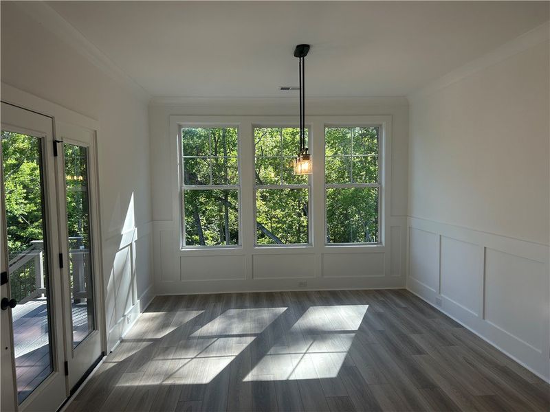 This bright space offers tranquil tree views and e This bright space offers tranquil tree views and e
